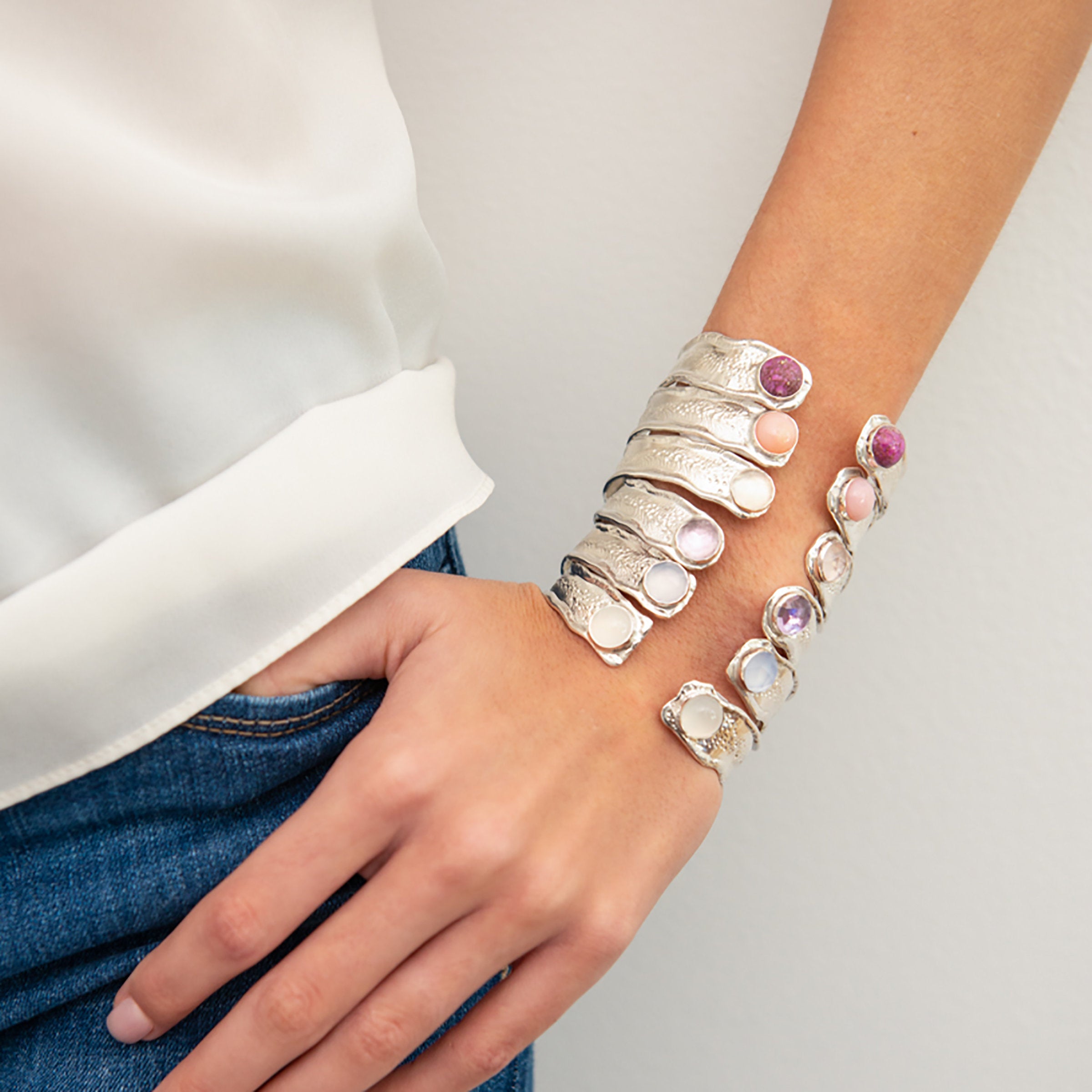Top to bottom: Sugilite, Pink Opal, Rose Quartz, Pink Amethyst, Natural Chalcedony, Milky Quartz