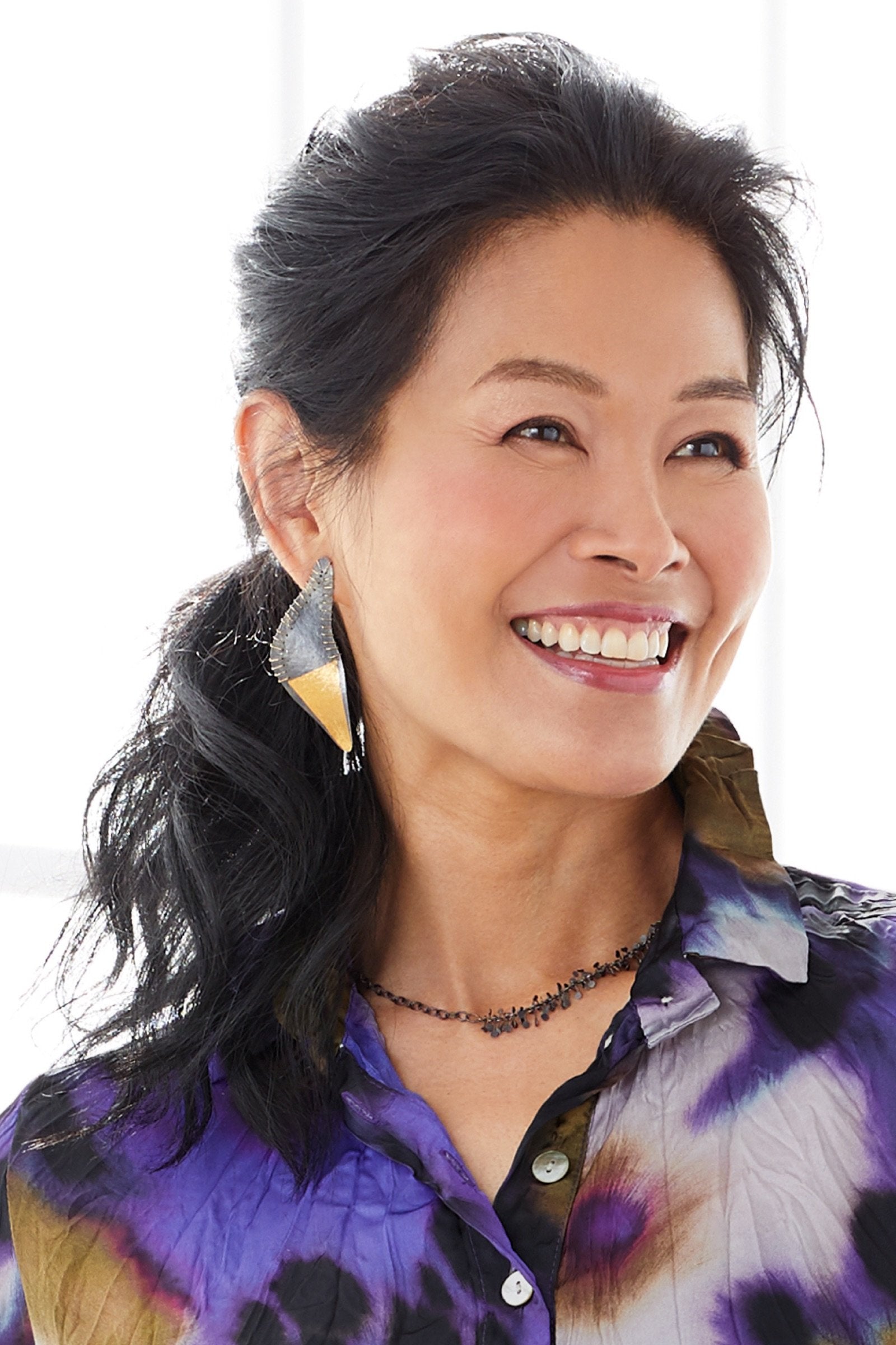 shown with the Stitched Edge Earrings by Suzanne Schwartz