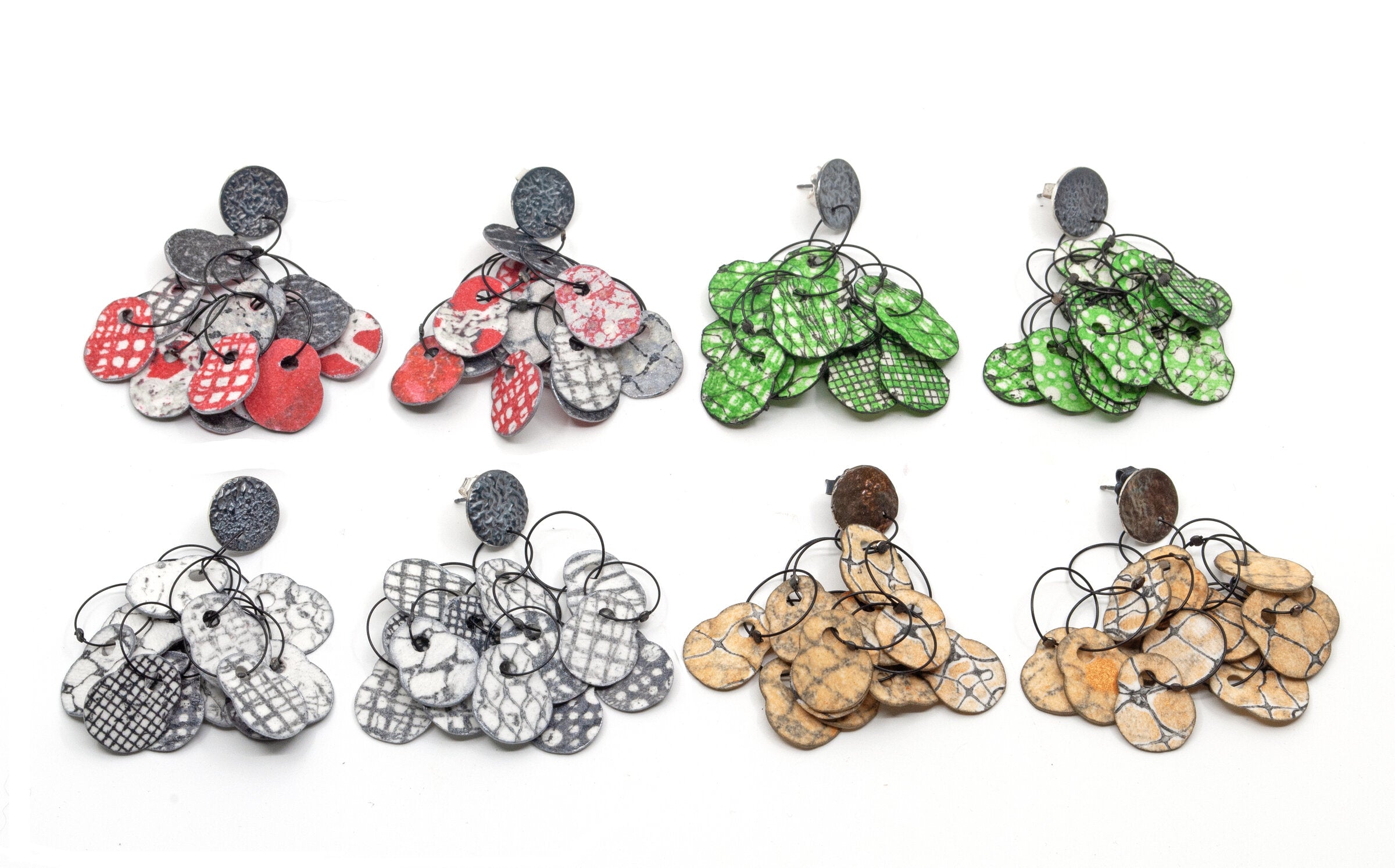 Left to Right: Red & Black, Green & Black, Black & White, Copper & Gray