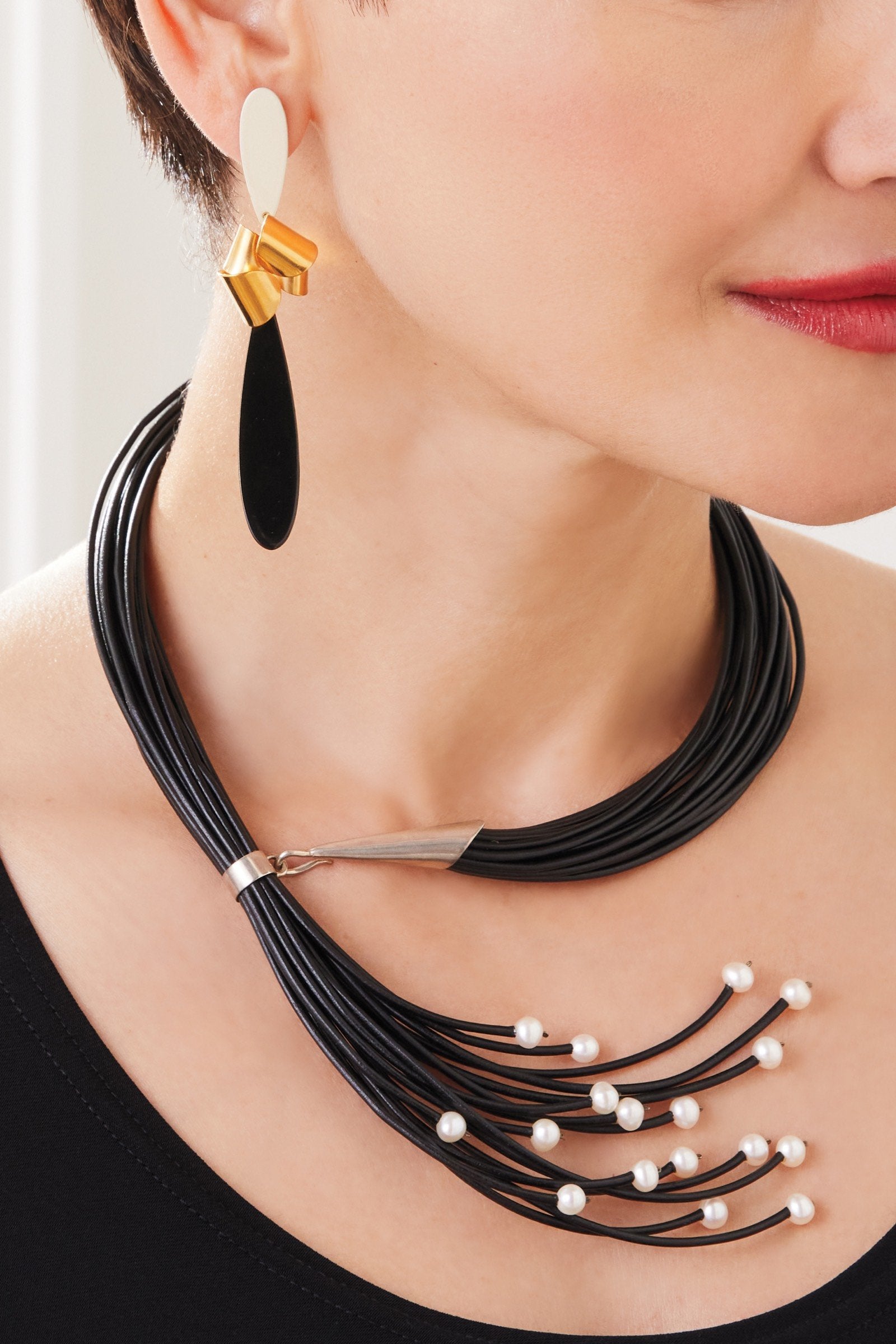 shown with Sixteen Pearl Leather Necklace by Kathleen Lamberti