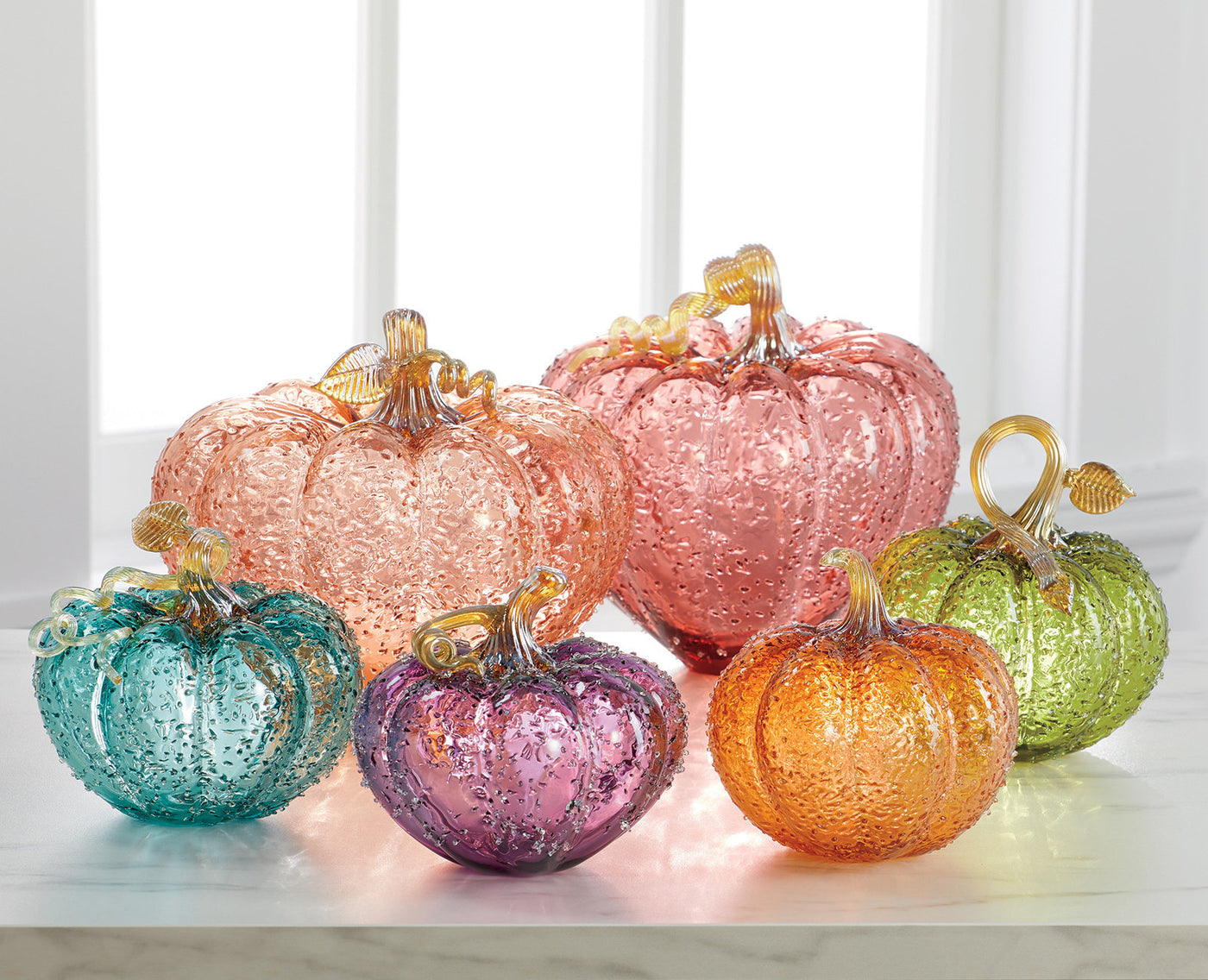 back row left to right: large Orange sapphire, large madeira citrine; front row left to right: medium aquamarine, medium amethyst, medium imperial topaz, medium kiwi topaz