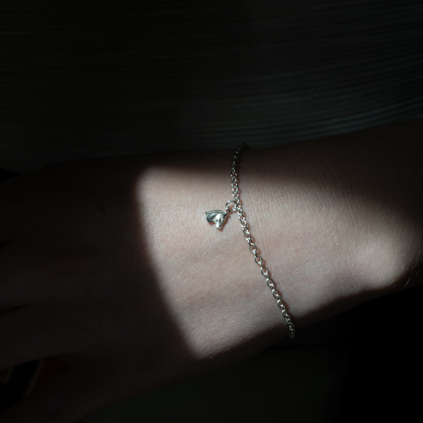 Horse Charm in bright silver on Model, chain not included with charm