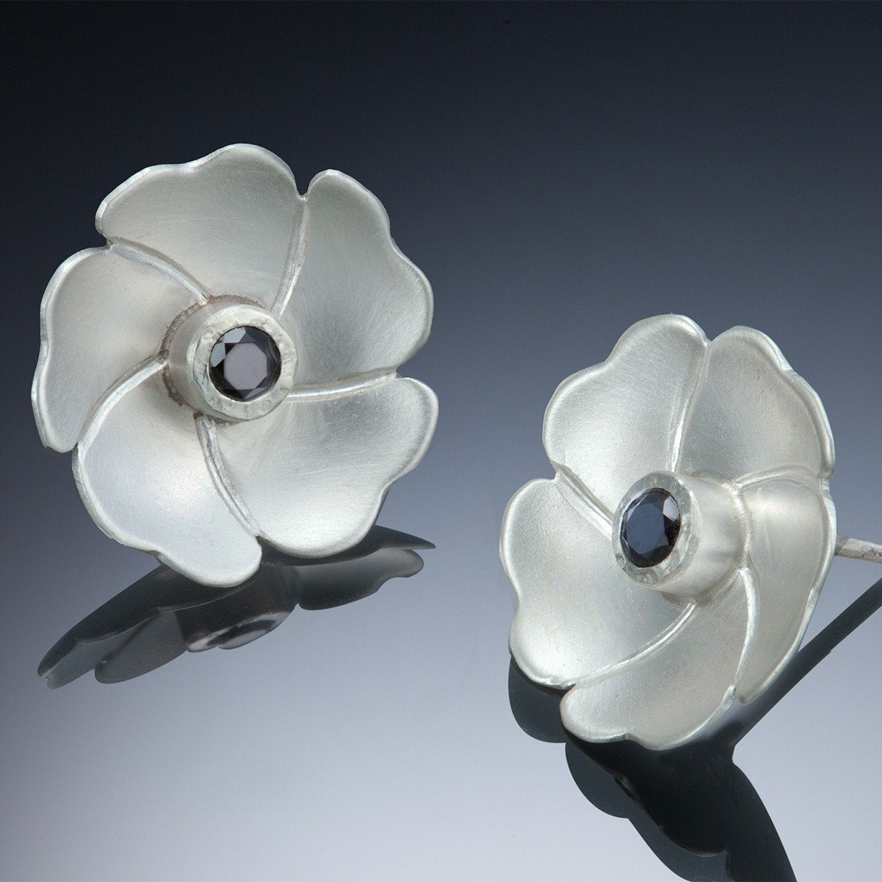 silver with black spinels