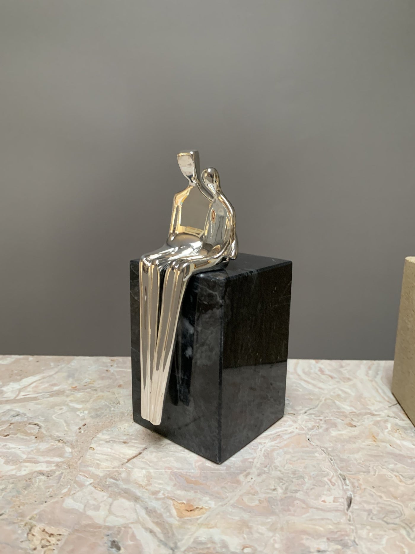 silver with black marble base