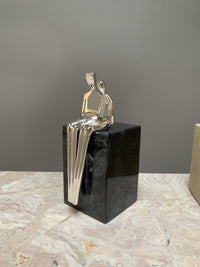 silver with black marble base