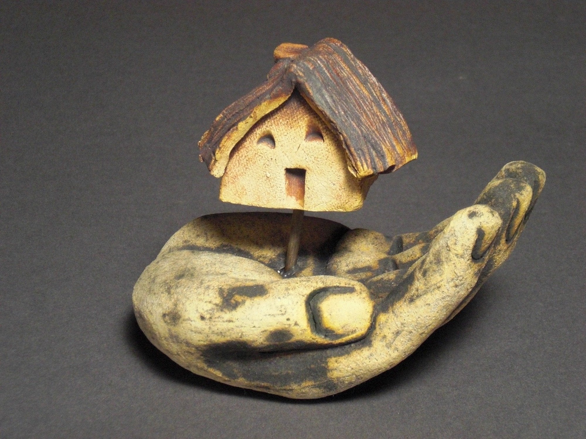 Hand with House