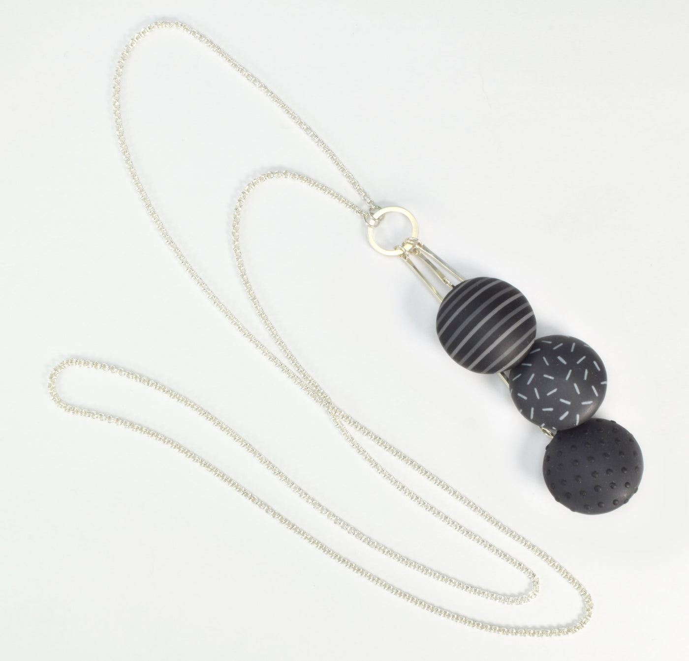 Triple lentil pendant with complete chain