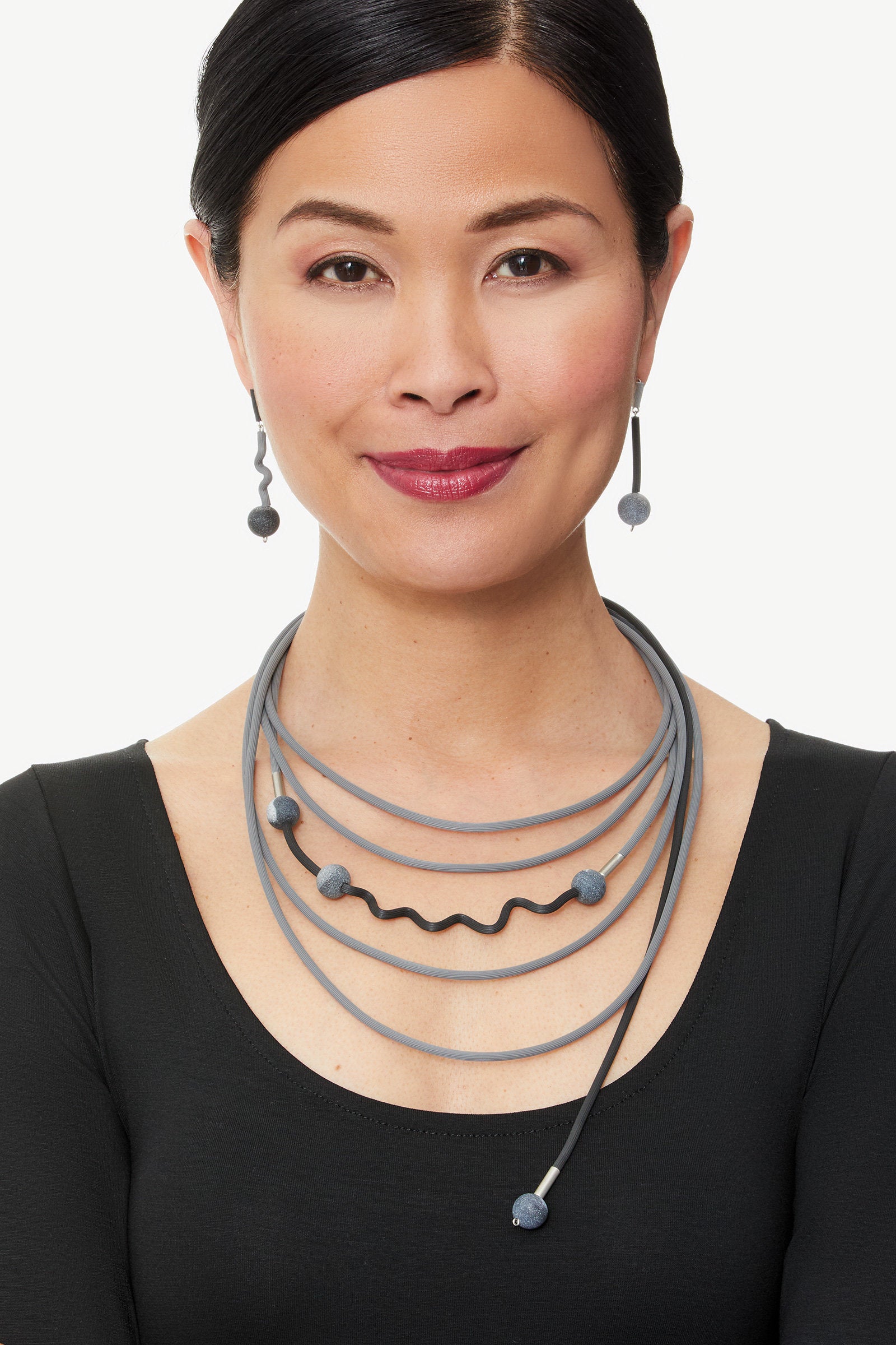 shown with harmony necklace