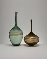 right to left: tall steel bottle, wide olive bottle