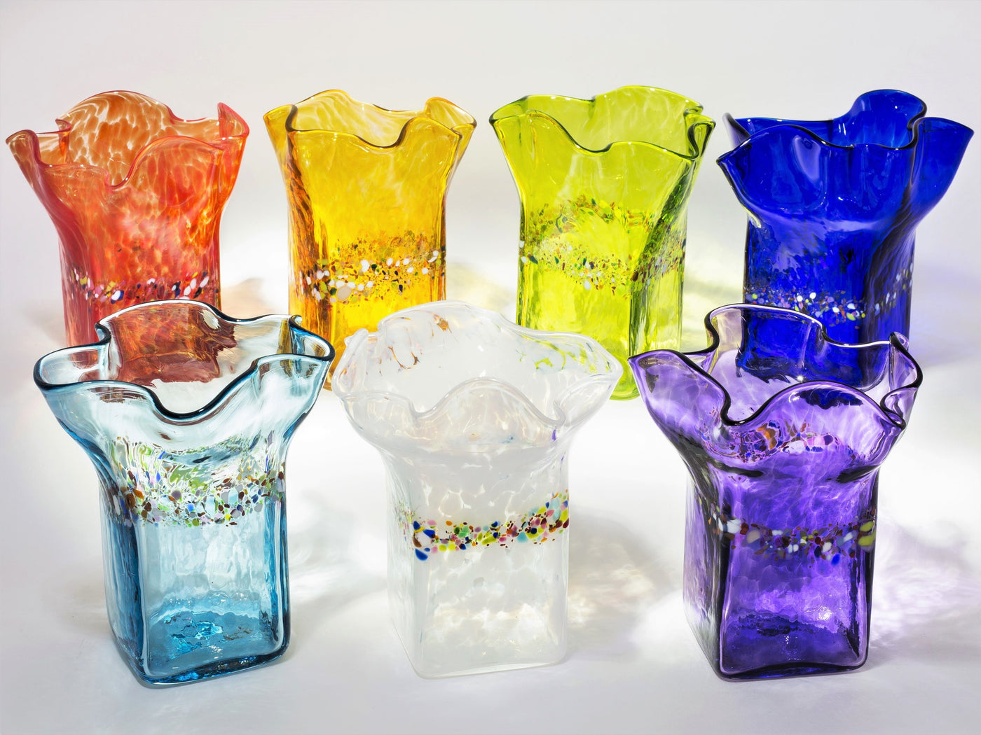 back row left to right: red, gold, lime, cobalt; front left to right: aqua, white, purple