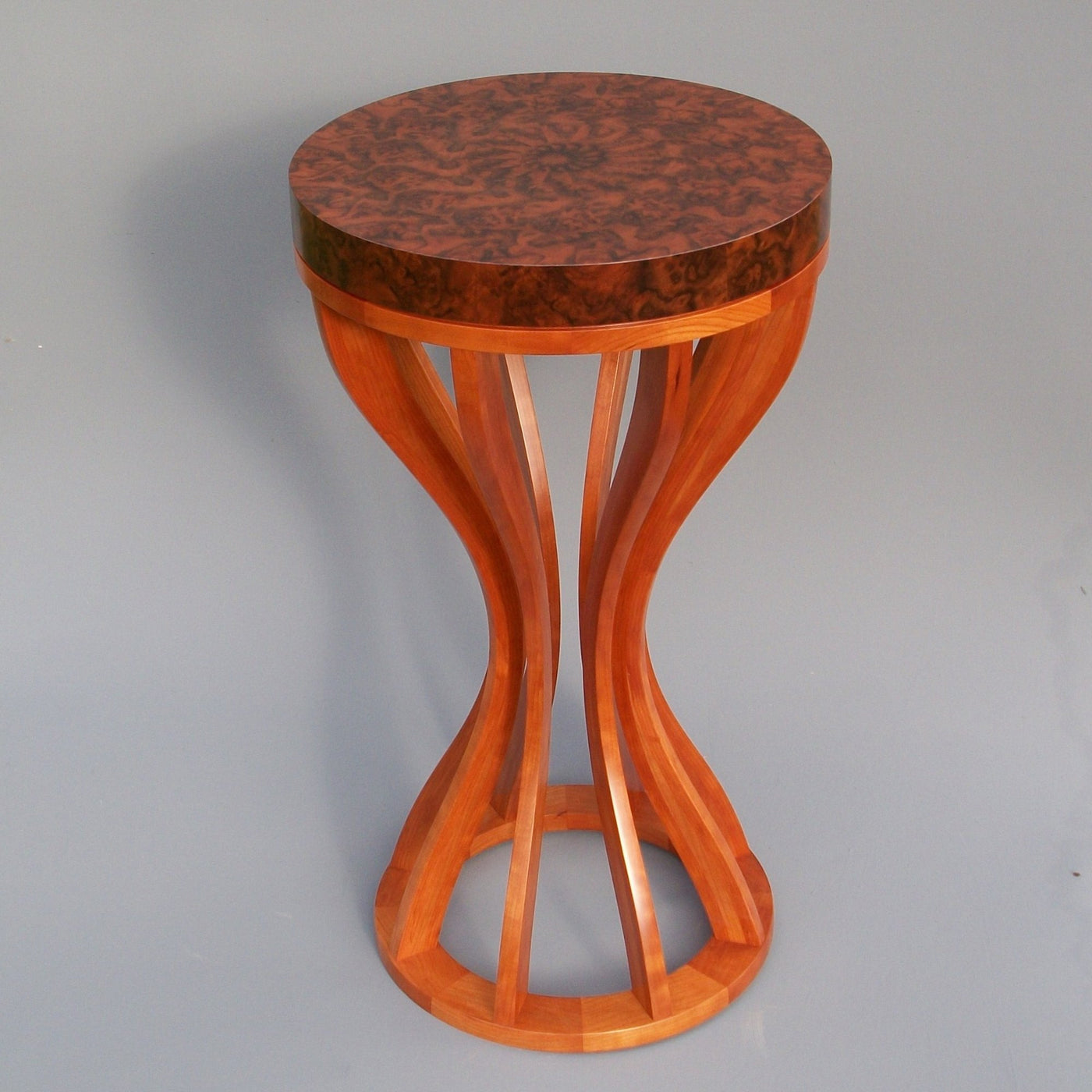 this shows the patina on an aged walnut burl and cherry table