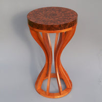 this shows the patina on an aged walnut burl and cherry table
