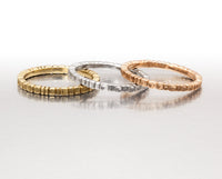 2mm rings without stones in yellow, white, and rose gold (left to right)