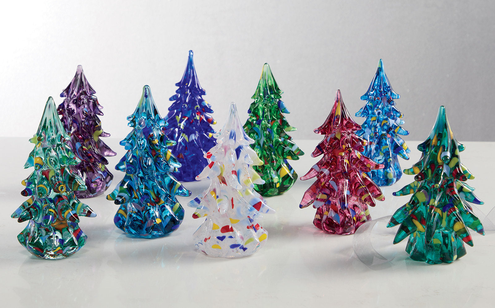 left to right: light emerald, purple, aqua, cobalt blue, white, dark green, ruby, light blue, light green