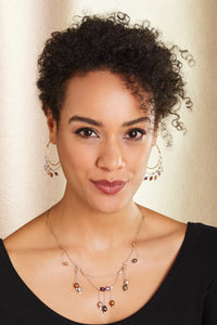 shown with the artist's large spring hoops