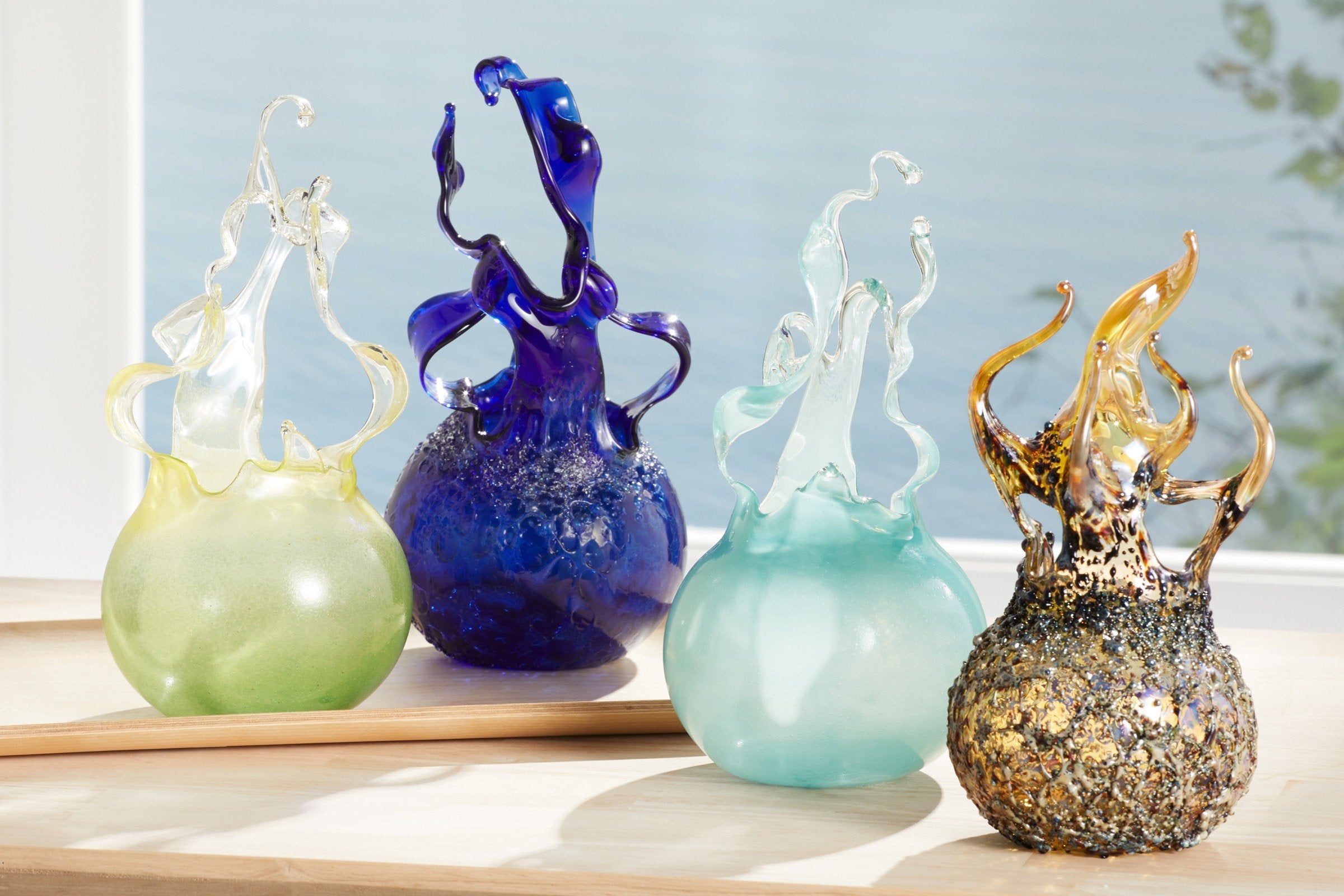 left to right: lemon lime raindrop, crystal cobalt raindrop, aqua raindrop, granite fireball