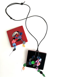 Showing both sides of the pendant