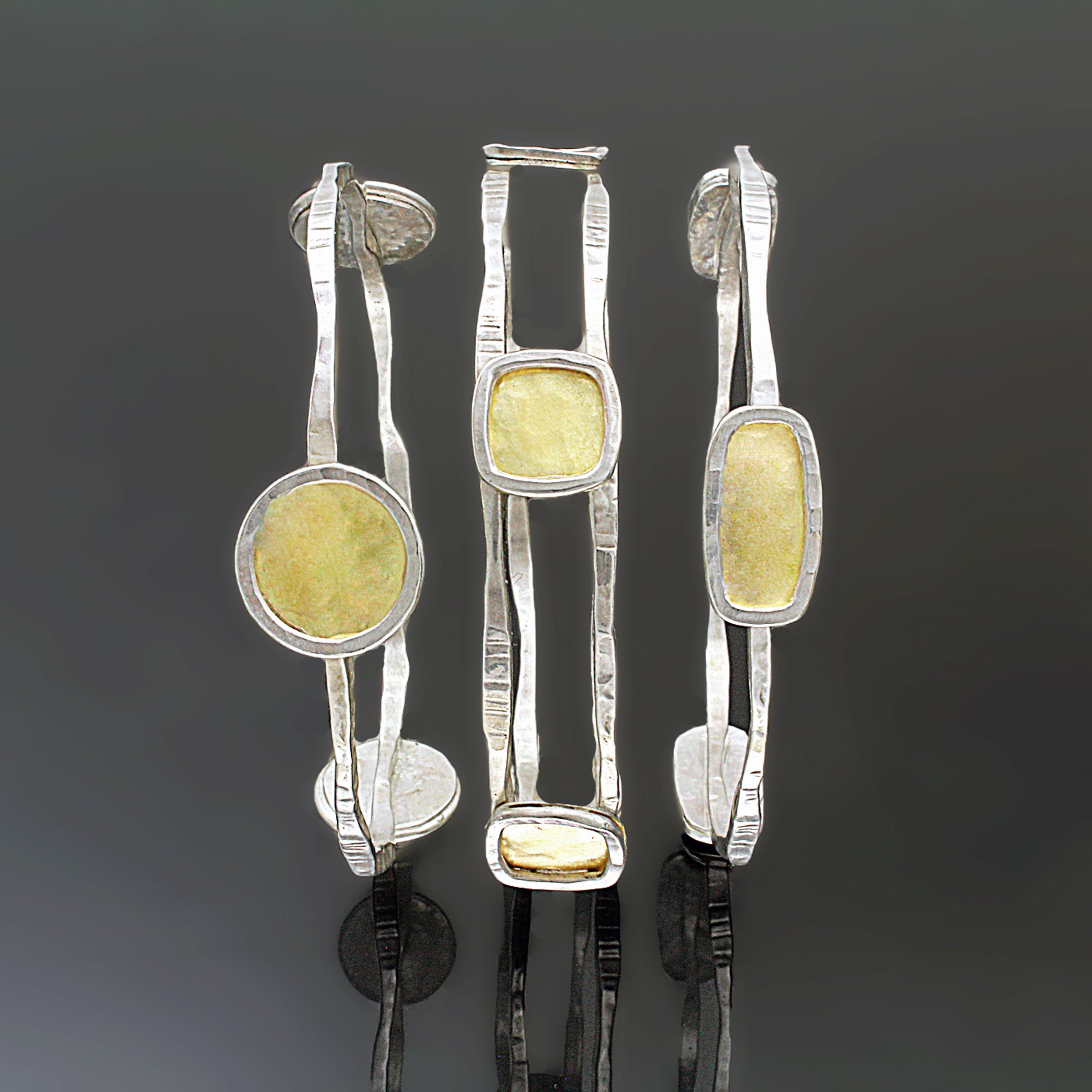 Left to right: Large Circles Bangle, Squares Bangle, and Rectangle Bangle