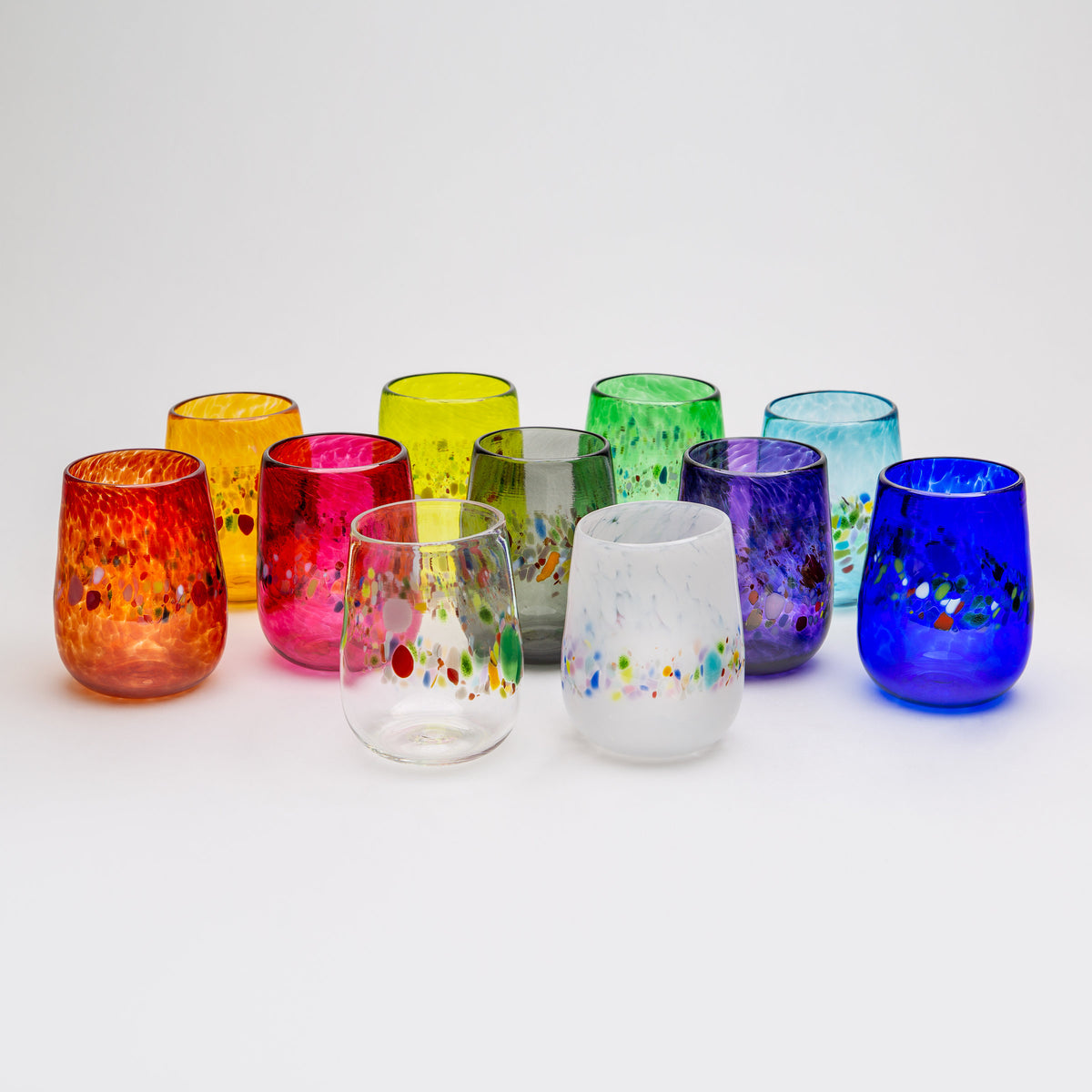 back row left to right: gold, lime, emerald green, aqua; middle row left to right: red, pink, gray, purple, cobalt; front row left to right: clear, white