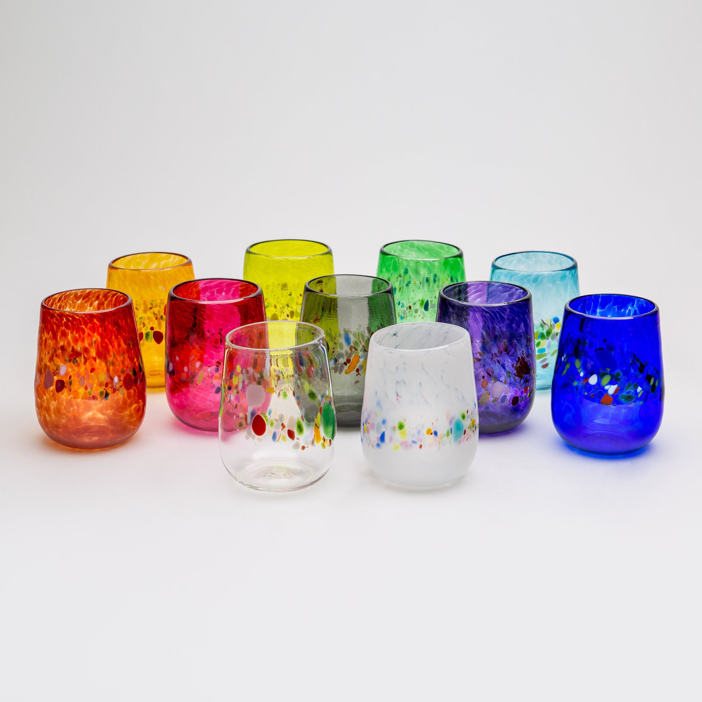 back row left to right: gold, lime, emerald green, aqua; middle row left to right: red, pink, gray, purple, cobalt; front row left to right: clear, white
