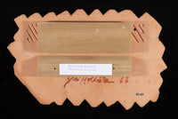 Back of tile with mounting board. Top board is mounted to tile with construction adhesive. Bottom board is to be mounted on the wall. Top board locks into bottom board when on the wall.