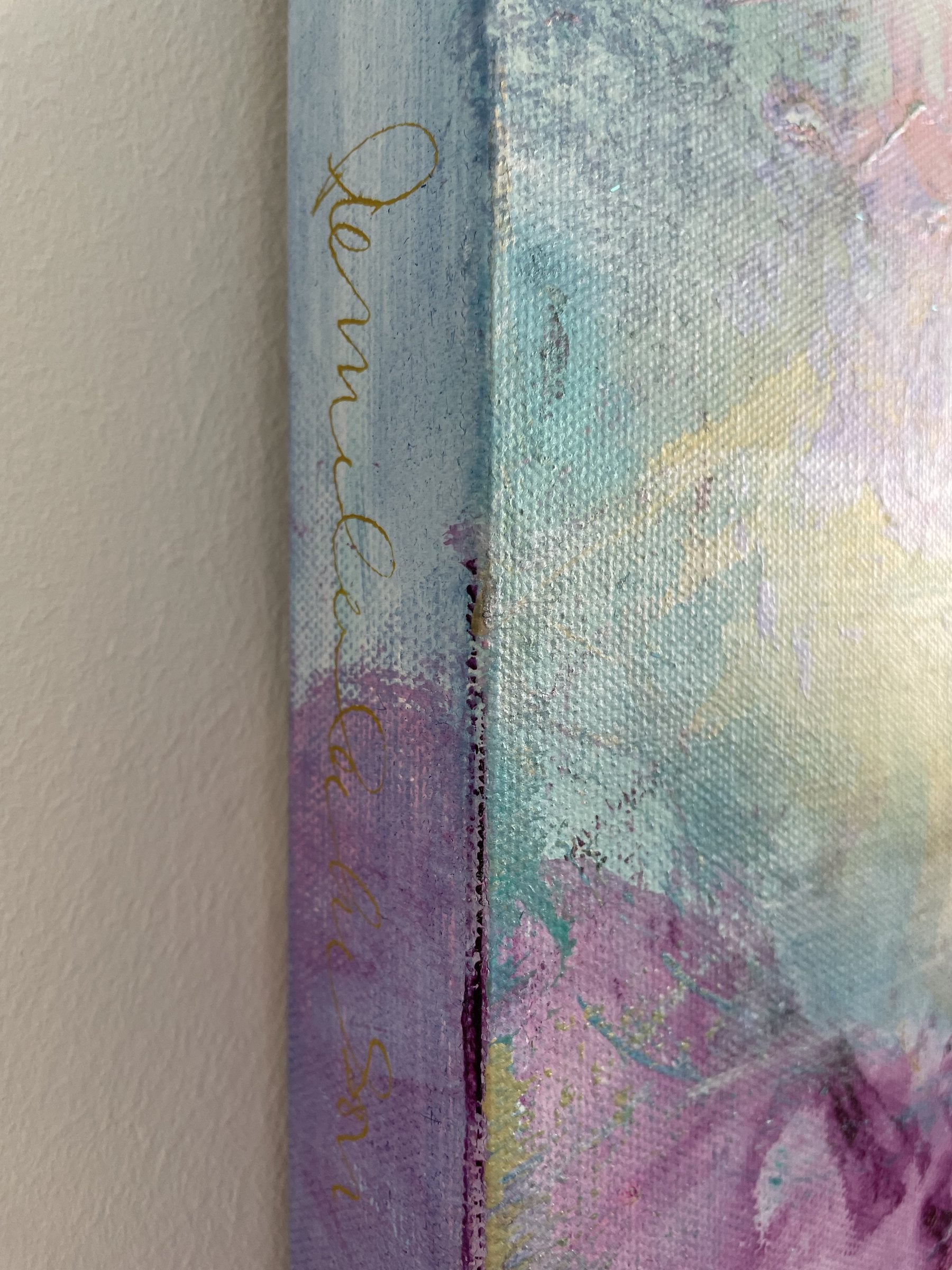 Shows part of signature on left horizontal side.