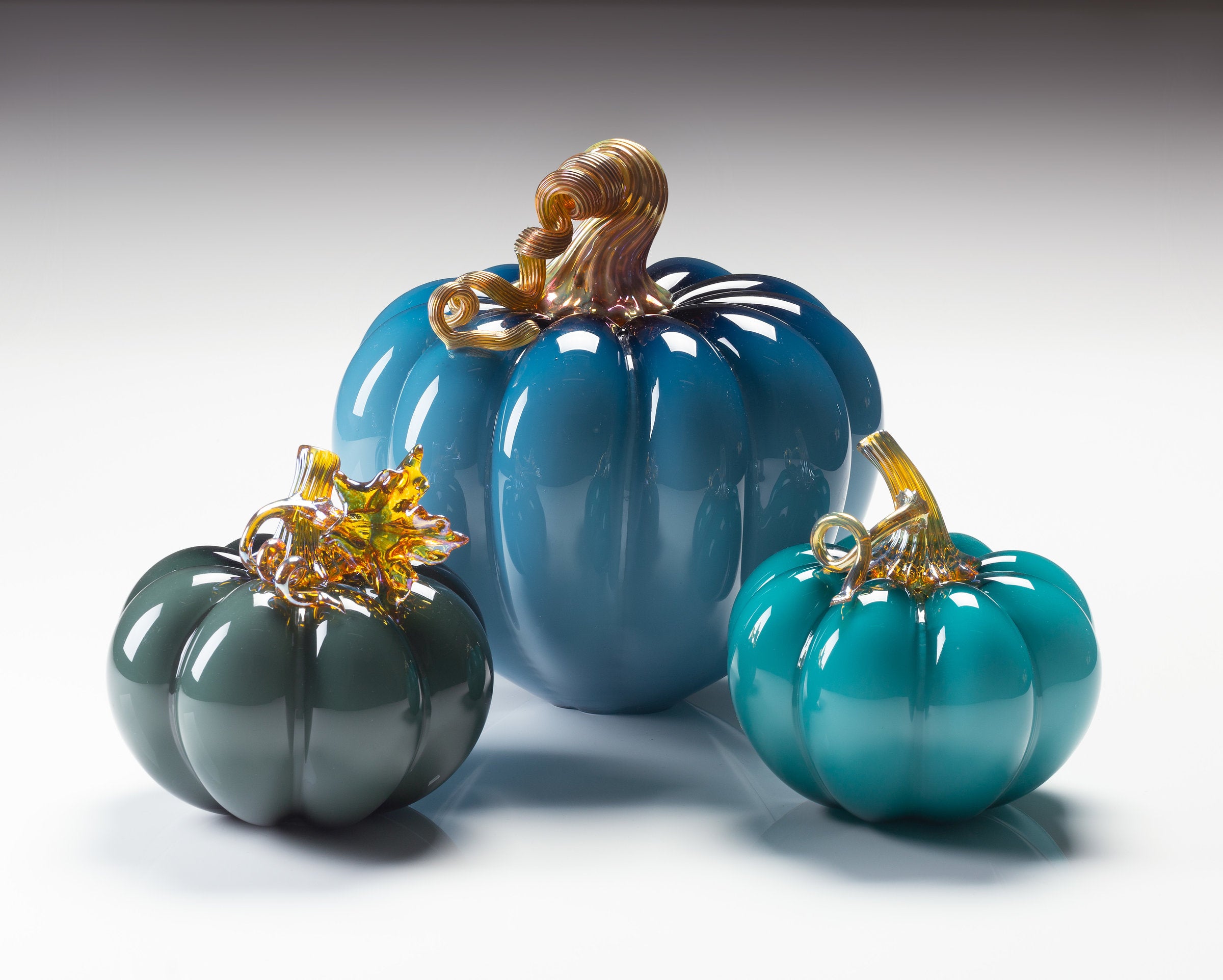 left to right: smoky blue, steel blue, lagoon