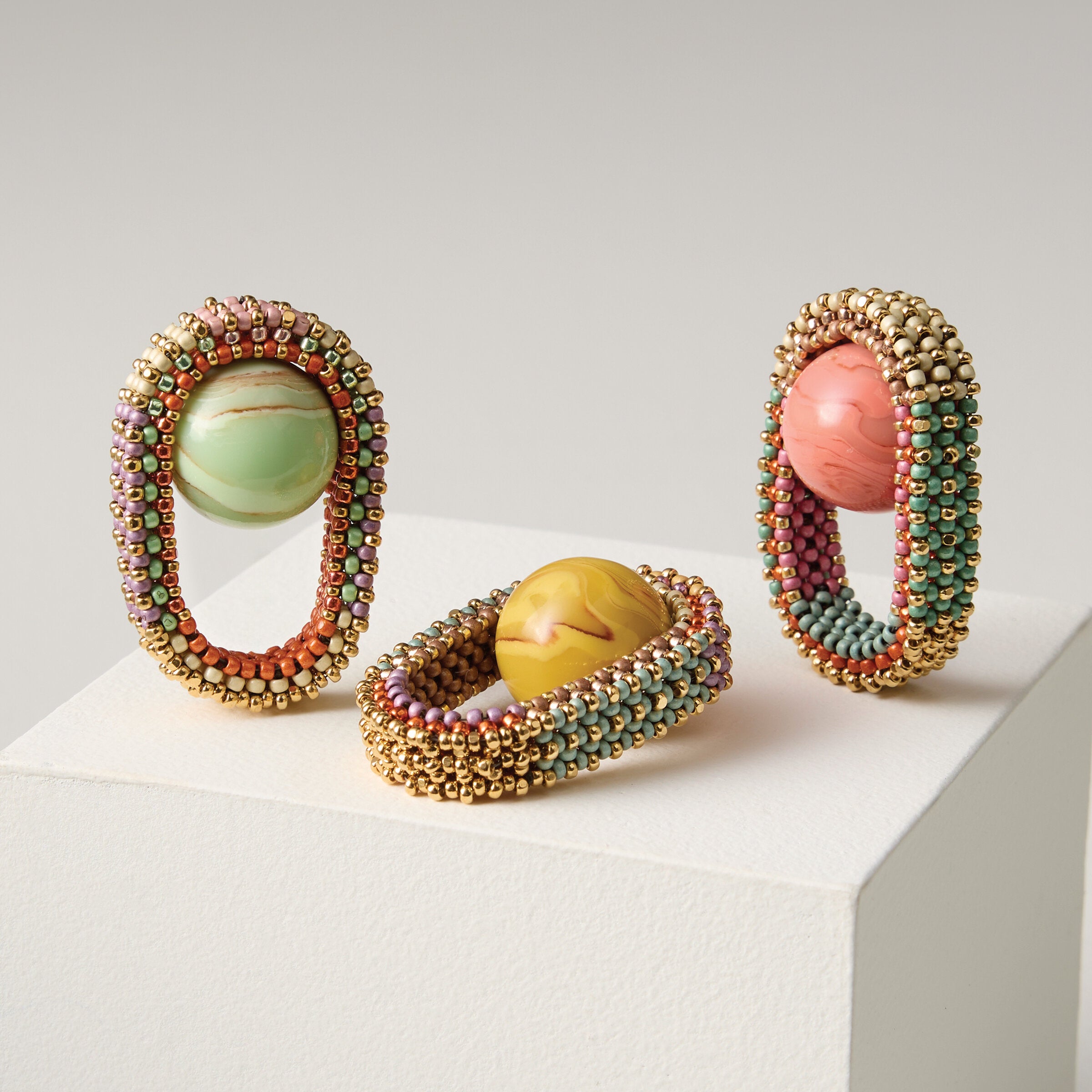 Left to right: Pistachio, Mustard, Coral