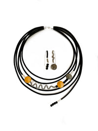 shown with the artist's coordinating ray of sunshine necklace
