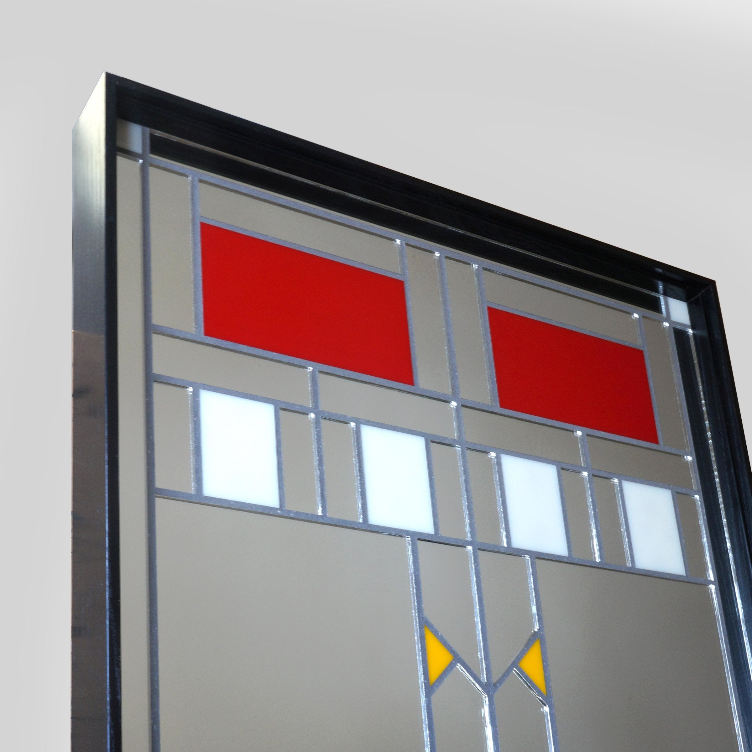 Side view of Arts & Crafts style mirror with red, white and yellow glass tiles