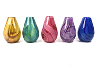 left to right: gold, green, pink, purple, blue