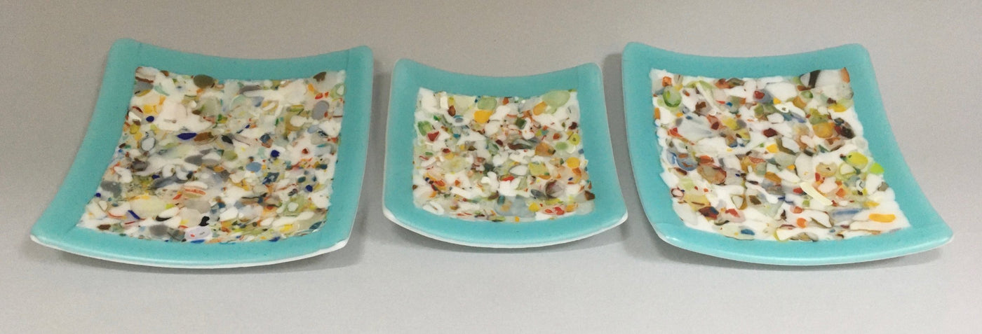 Three Confetti Plates on Blue