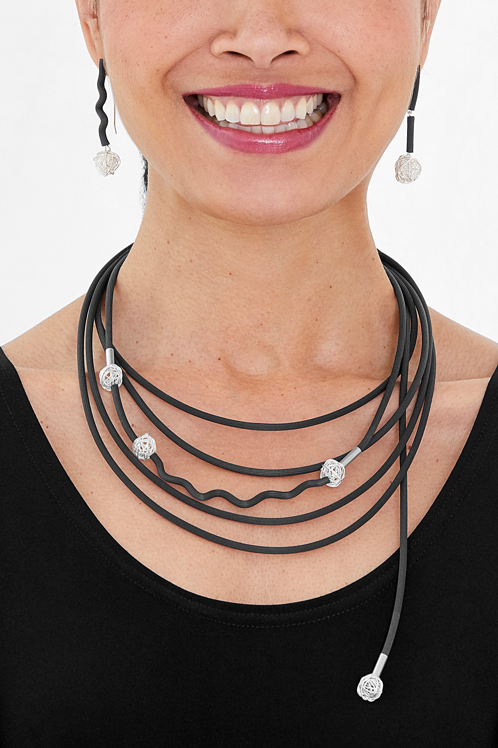 shown with the little silver knots necklace