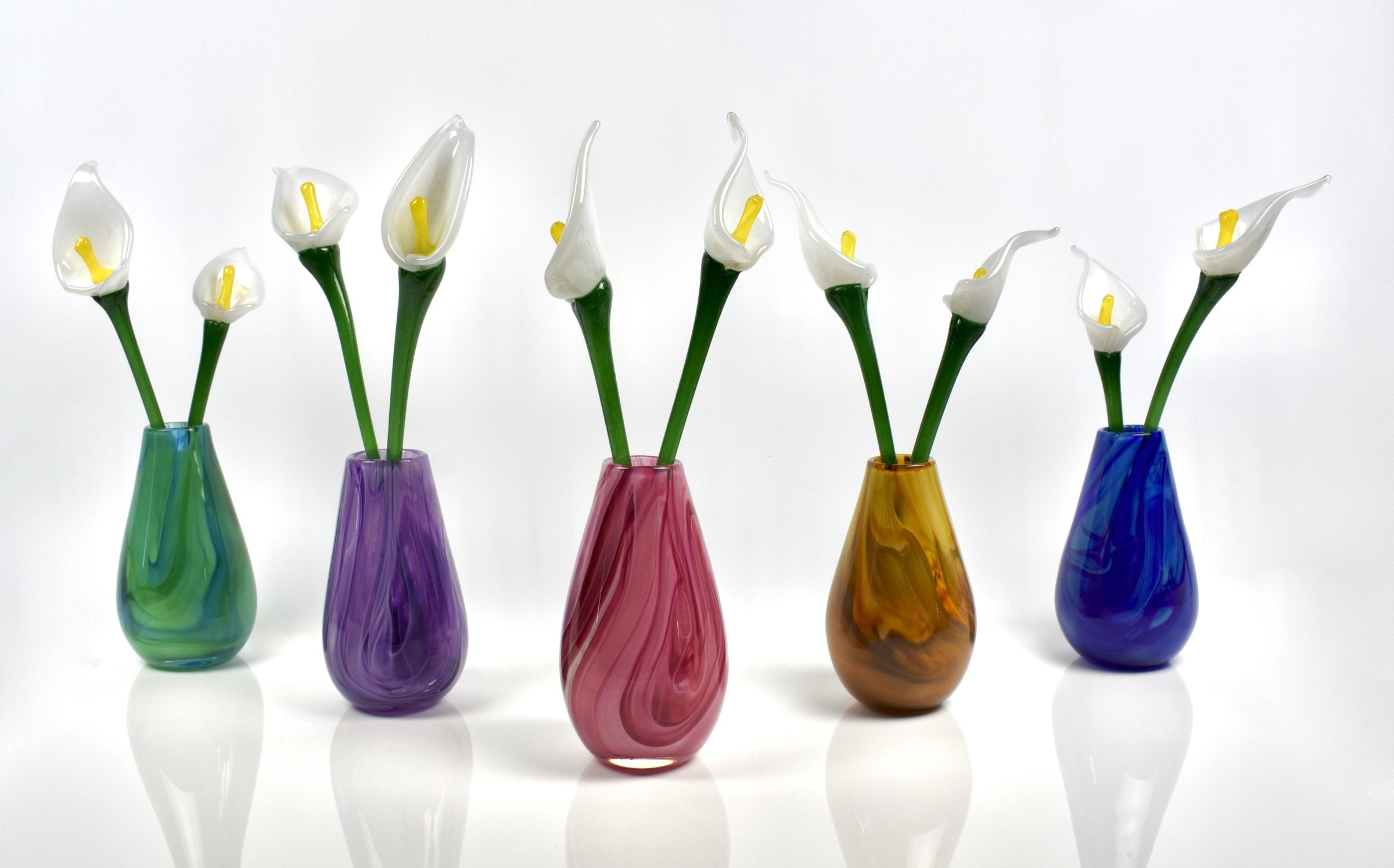 left to right: green, purple, pink, gold, blue