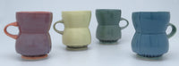 left to right: purple, yellow, green, blue