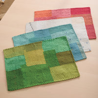 top to bottom of stack: lime green, cornflower, cauliflower, carrot