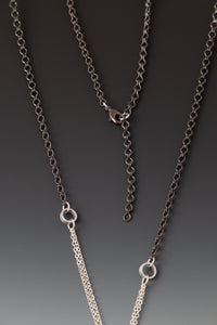 chain detail, clasp, and extender