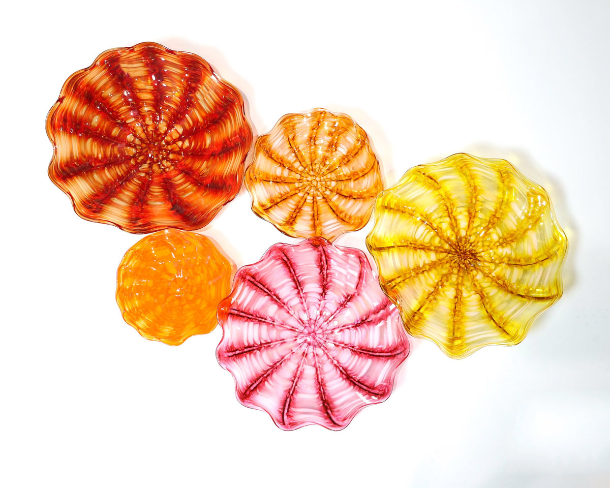 Clockwise from top left: large brick red, medium amber, large gold topaz, large pink, small orange