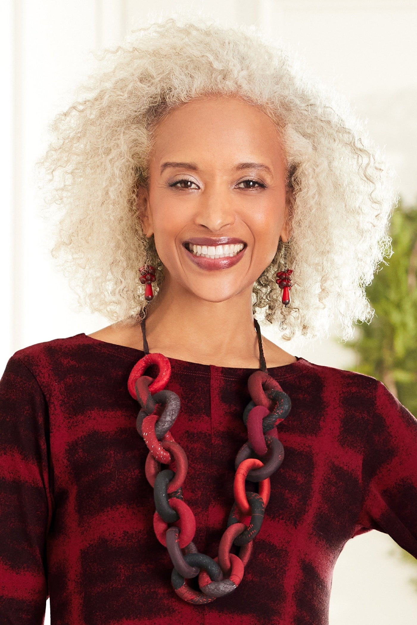 shown with the Red Teardrop Firecracker Earrings by Valerie Hector