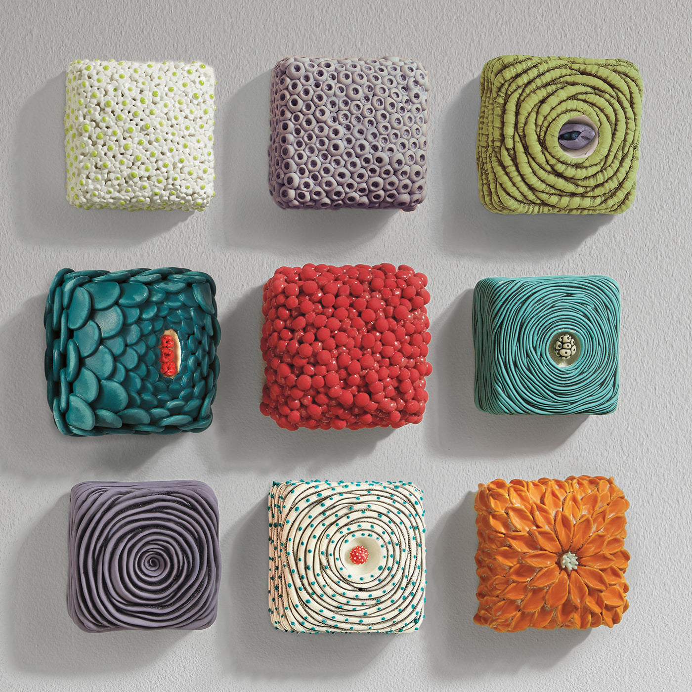 left to right, top to bottom: in bloom, lilac reef, spring green nest, painted lady, coral cluster, aqua nest, purple rose, labyrinth with blue dots, orange dahlia