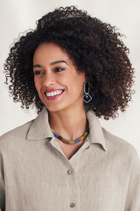 golden green, shown with the Silver and Sponge Coral Earrings by Boo Poulin