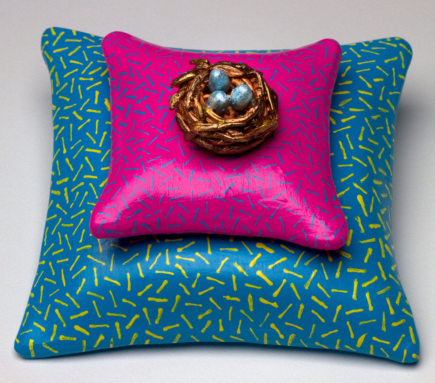Nest on Pink Pillow