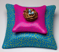 Nest on Pink Pillow