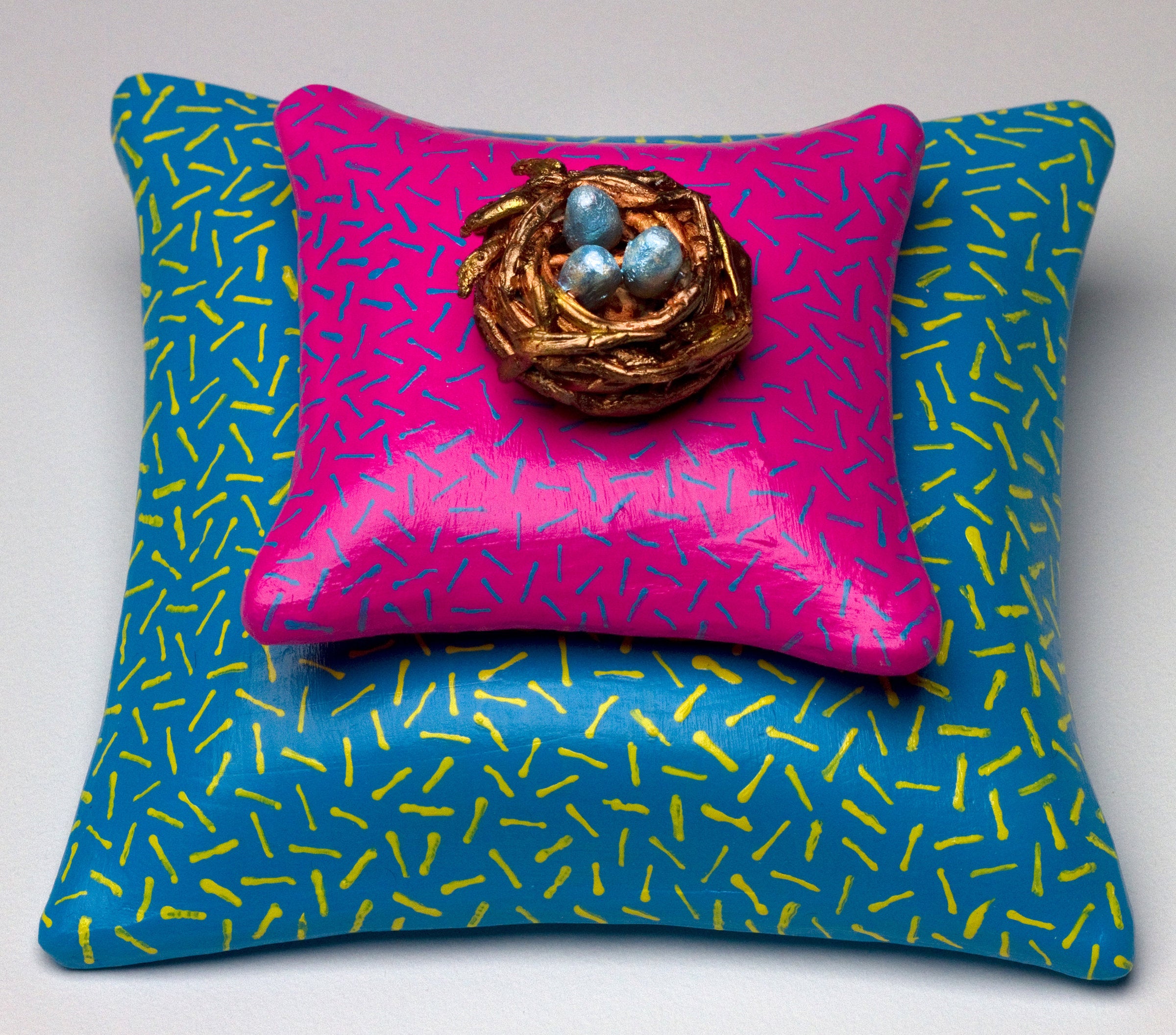 Nest on Pink Pillow