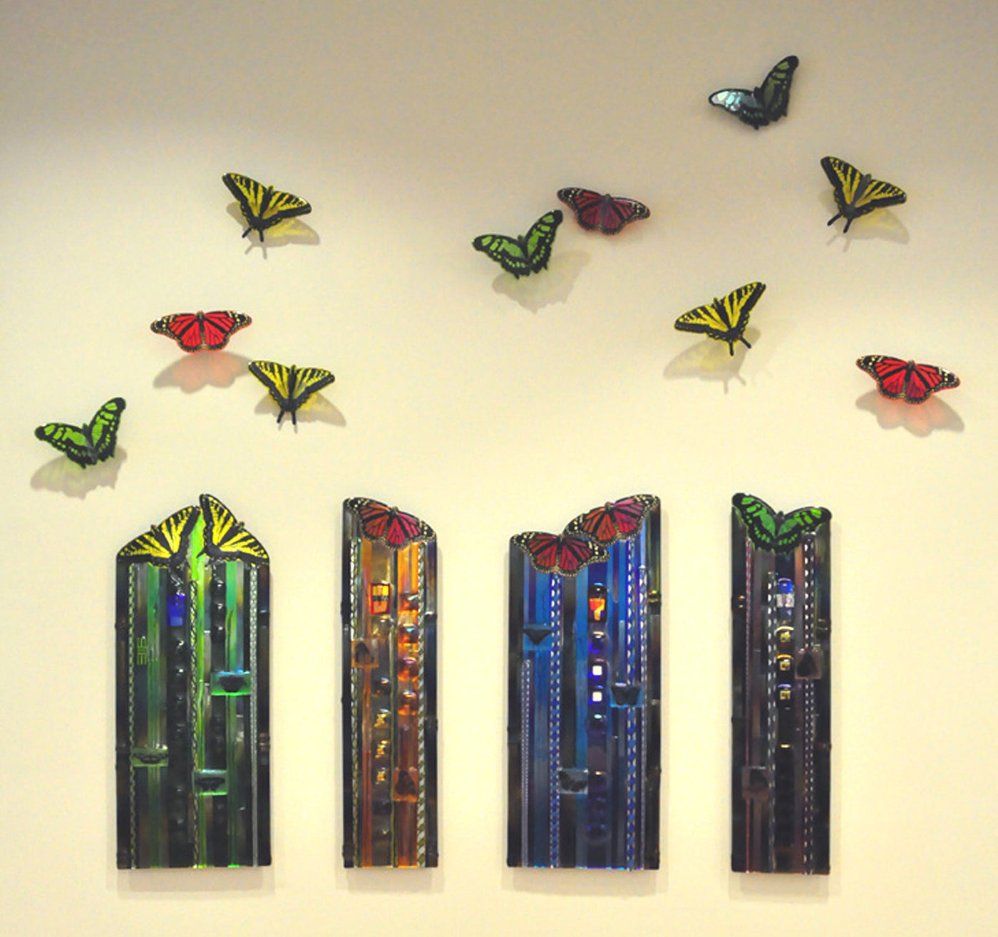 Set of Four Panels and Ten Butterflies; panel colors left to right: green, orange, blue, purple