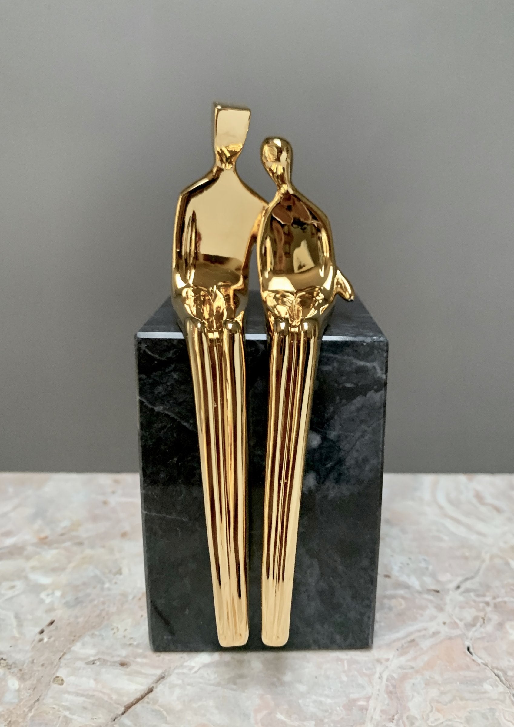 gold with black marble base