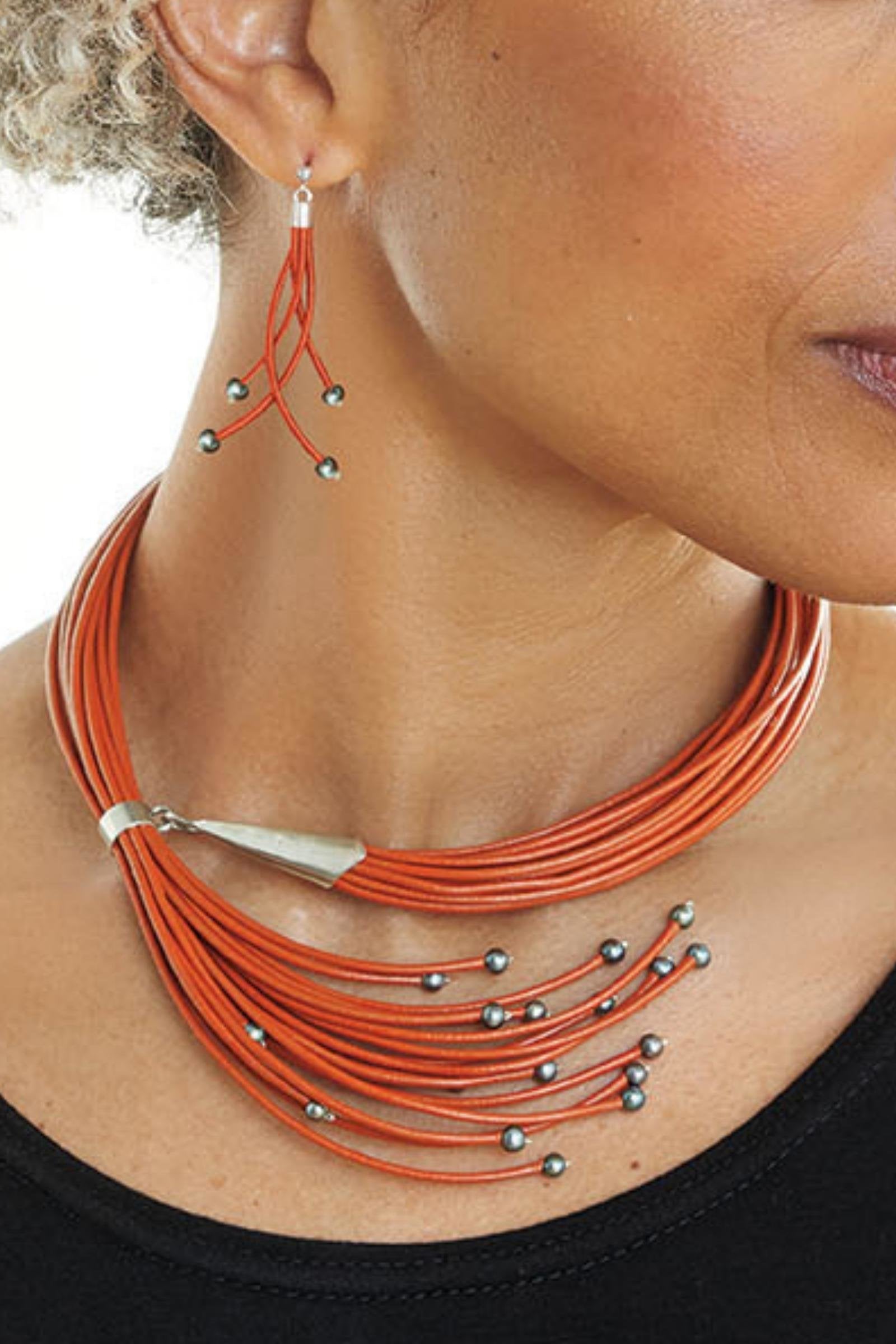 shown with the artist's sixteen pearl necklace