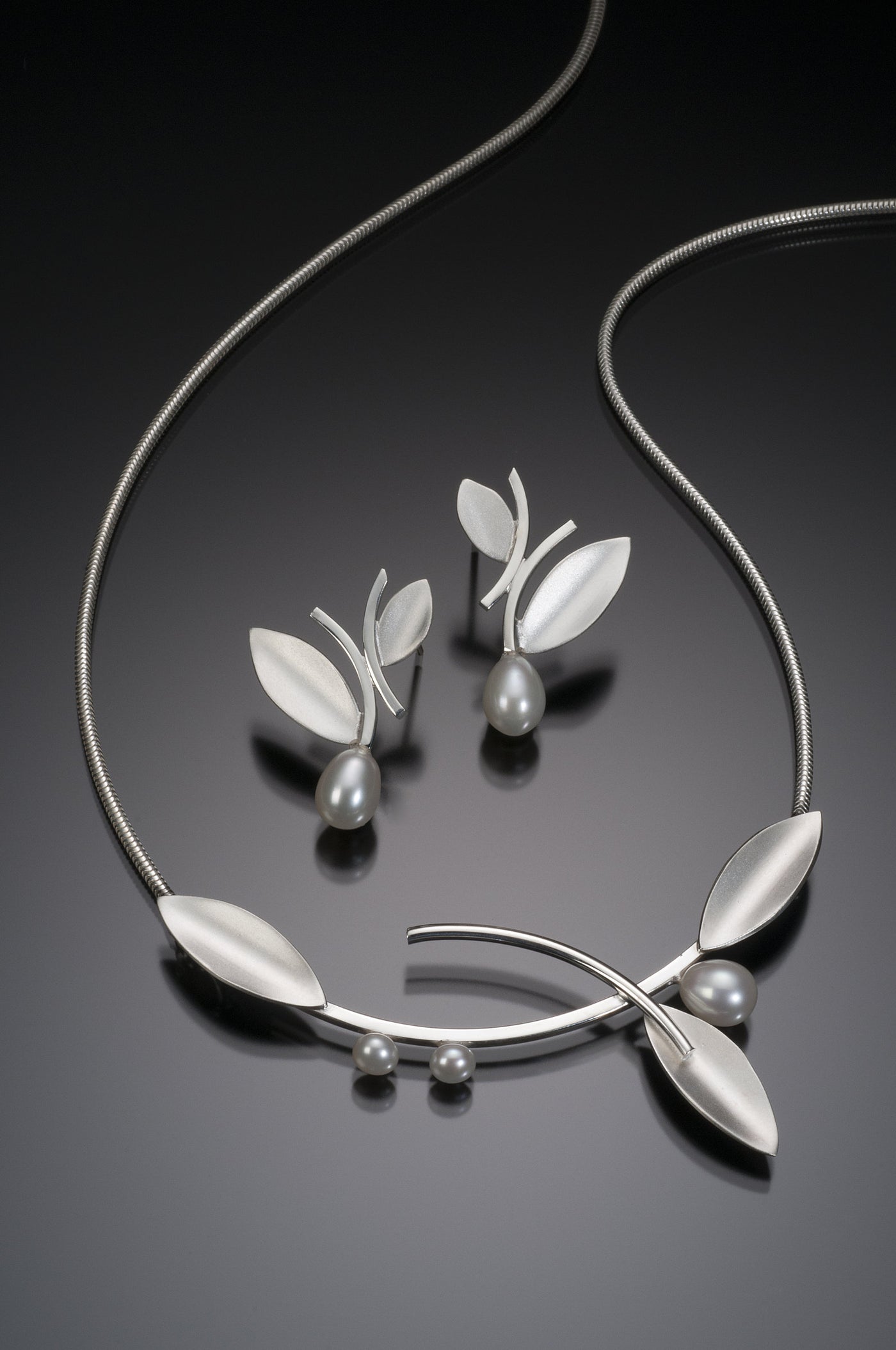 Bright Silver, shown with the artist's coordinating alternating leaf earring with pearl