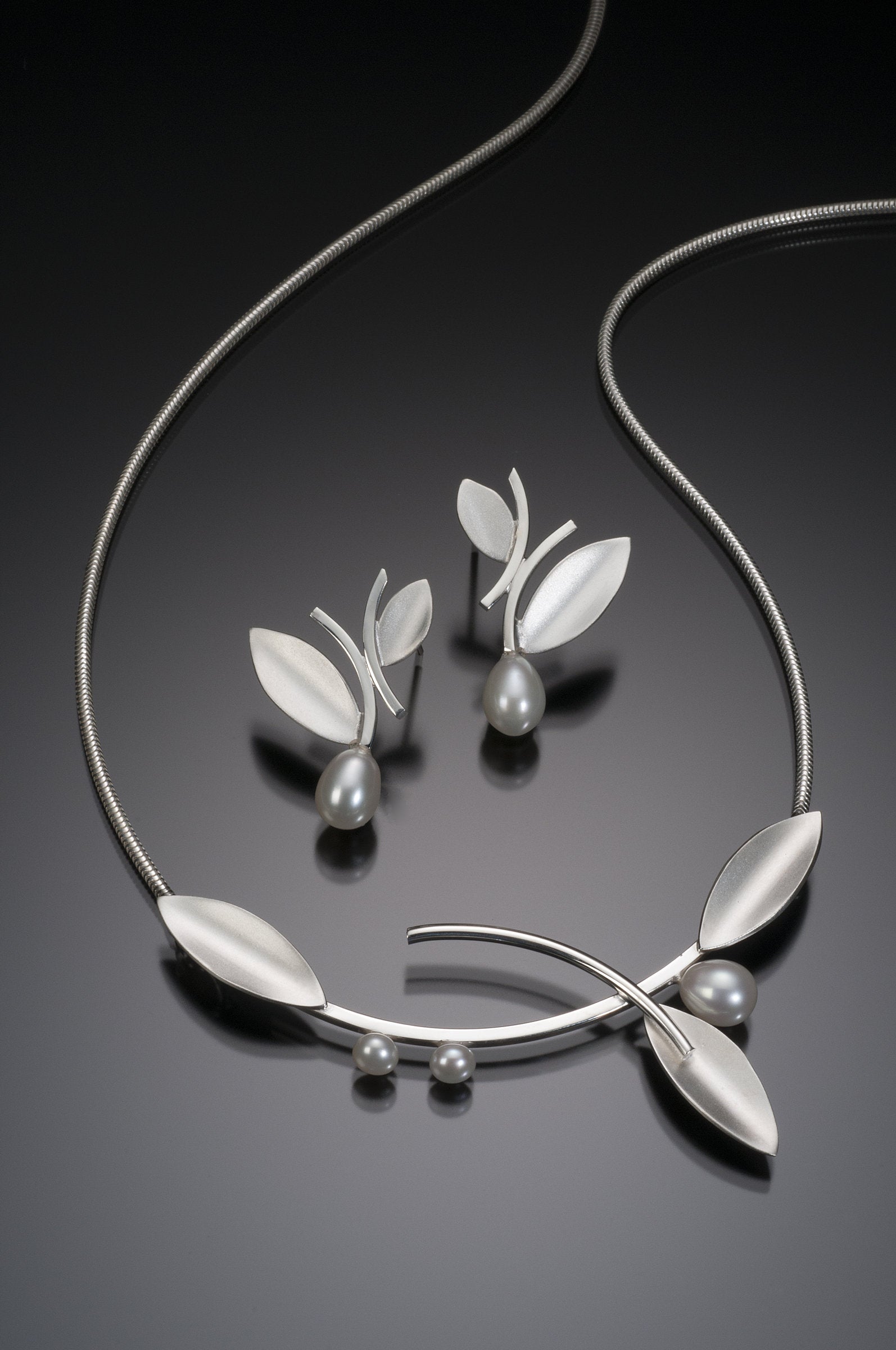 Bright Silver, shown with the artist's coordinating alternating leaf earring with pearl