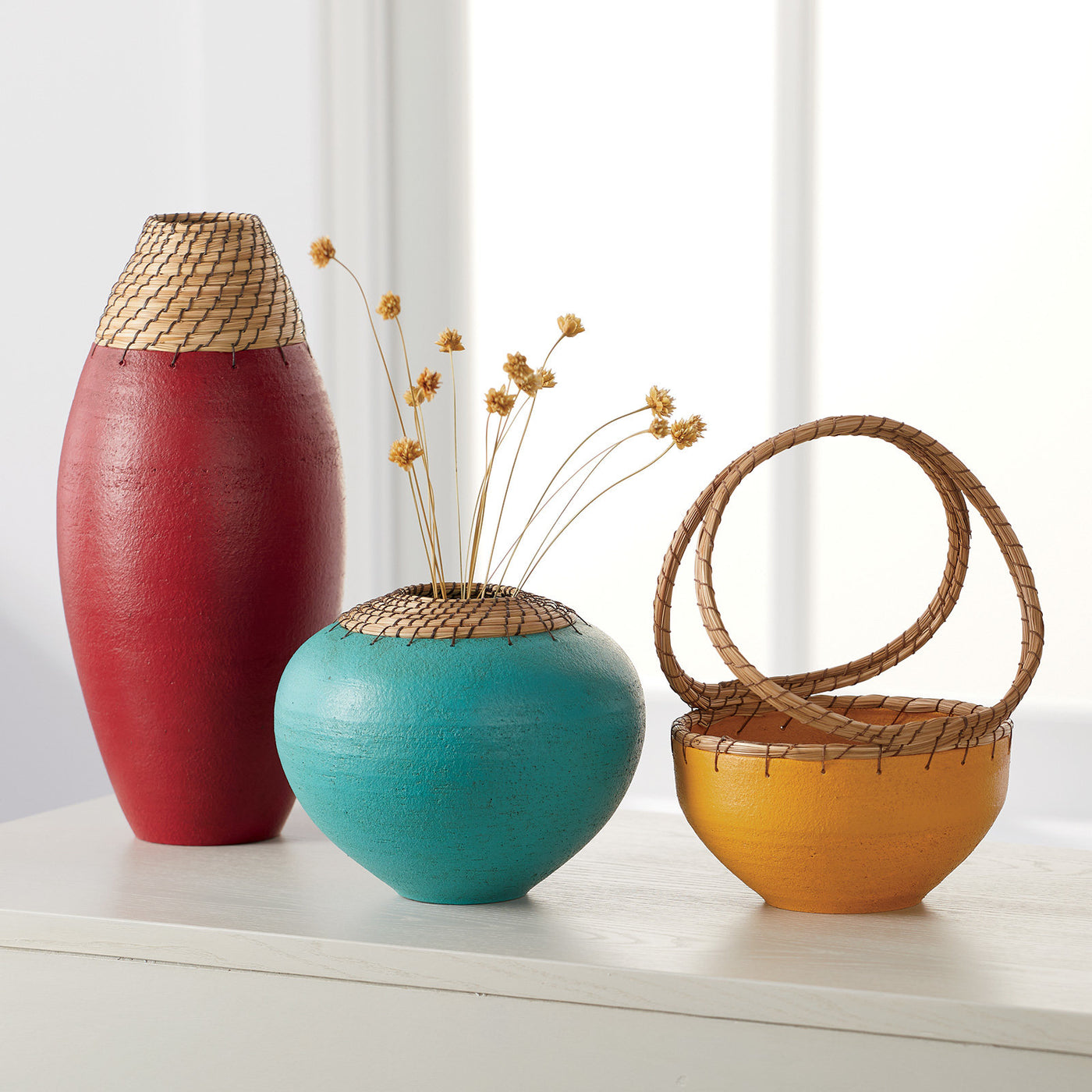 left to right: dark crimson bullet vessel, teal sphere vessel, yellow basket